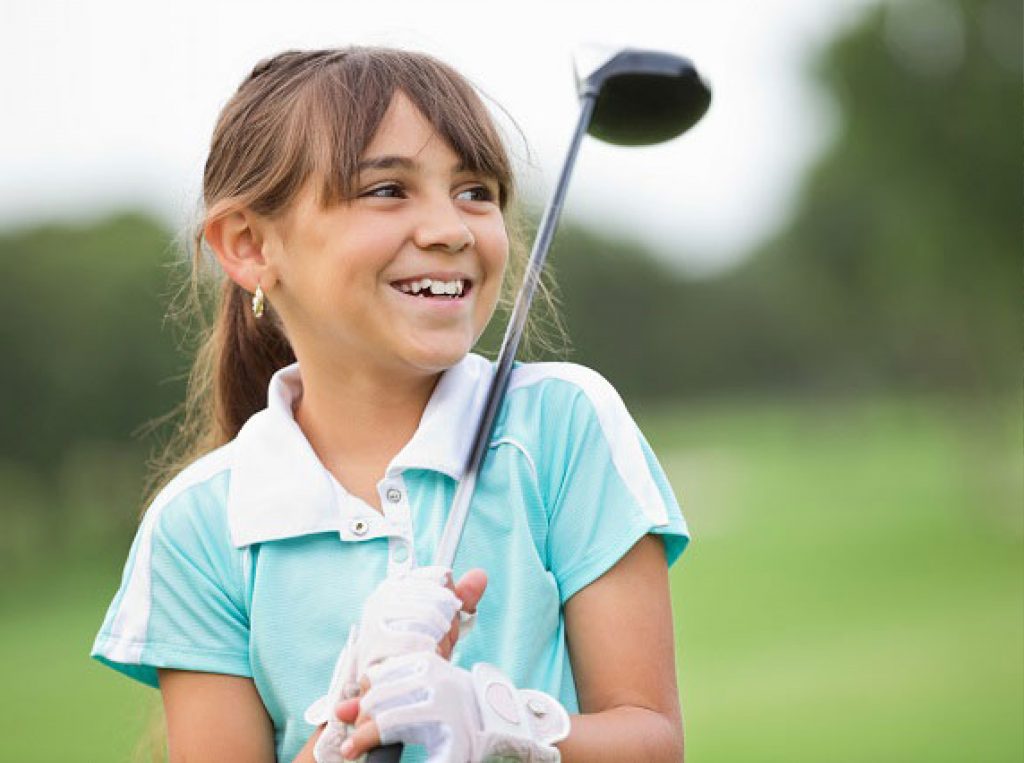 young girl with golf club