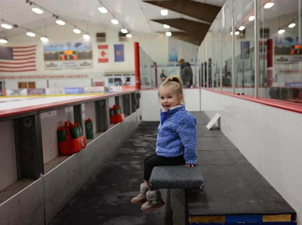 young girl getting ready to ice skate